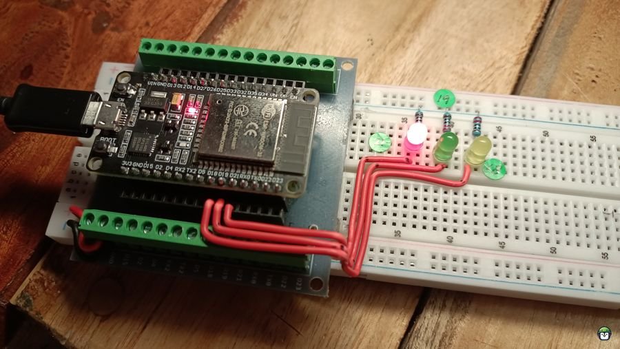 Close-up of the ESP32 on a breadboard, driving three LEDs through GPIO pins 18, 19, and 21, demonstrating independent control with timers.